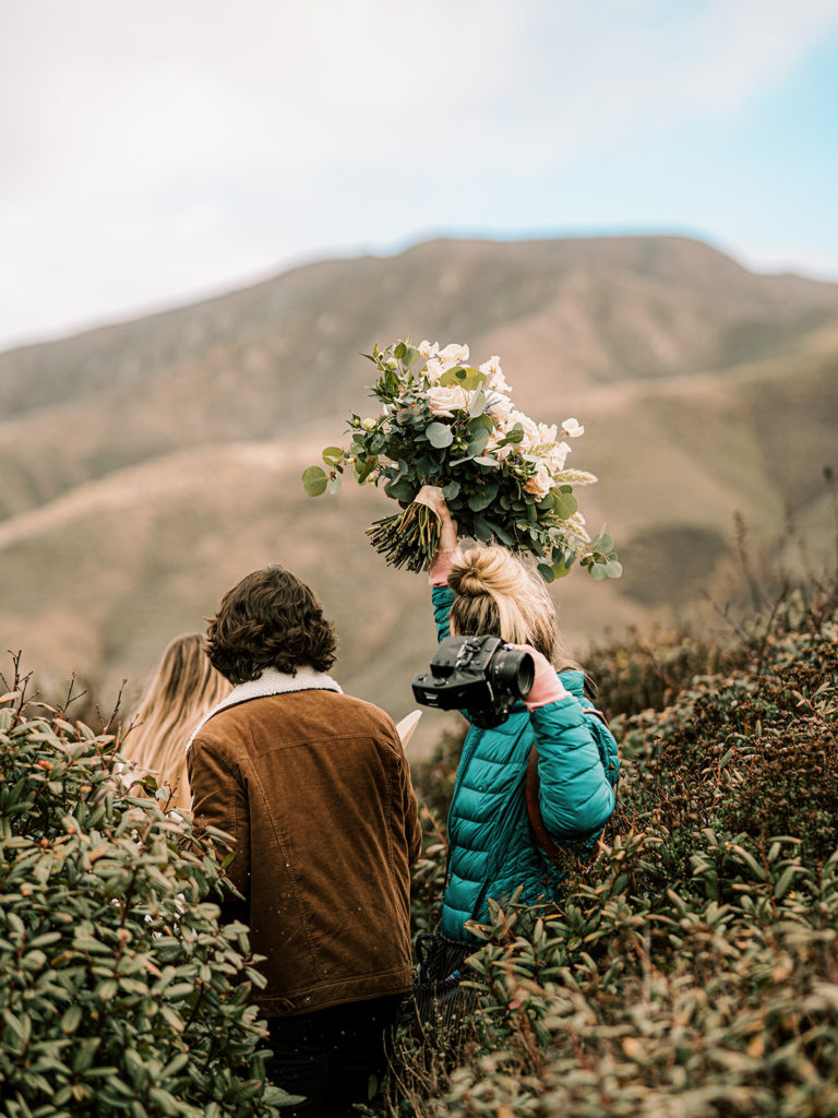 photographer captured photographing a couple during an adventure elopement session