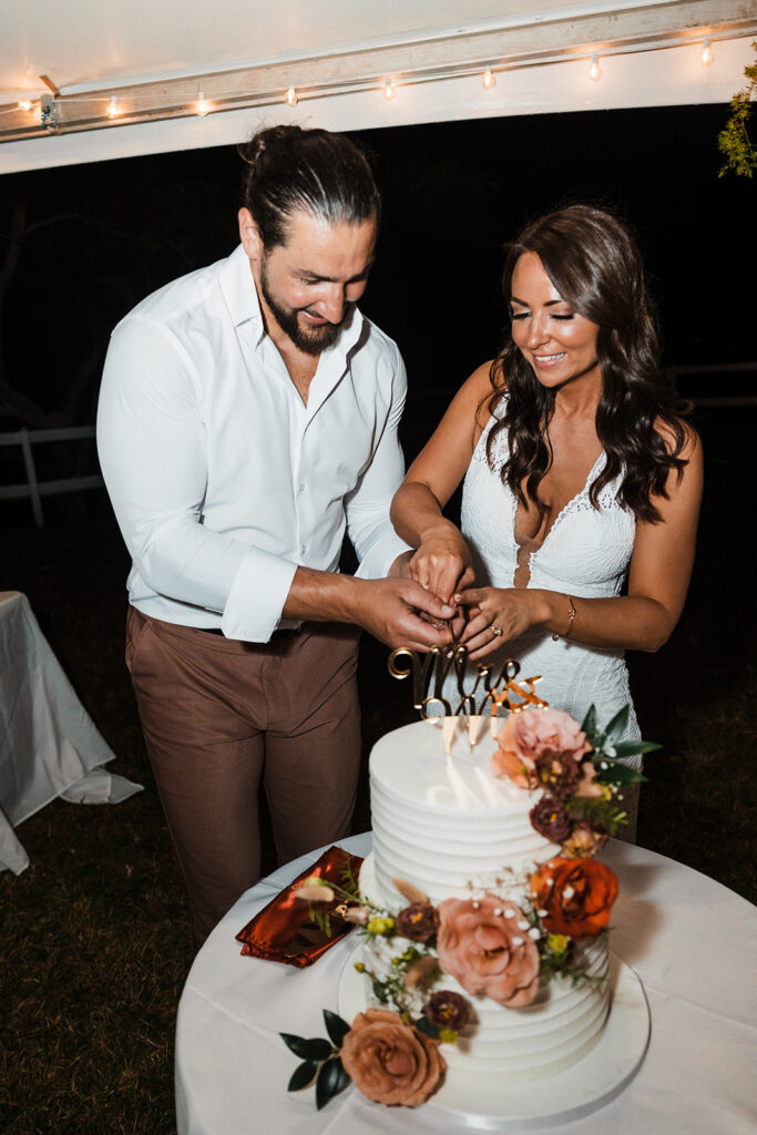 bride and groom cutting a wedding cake
